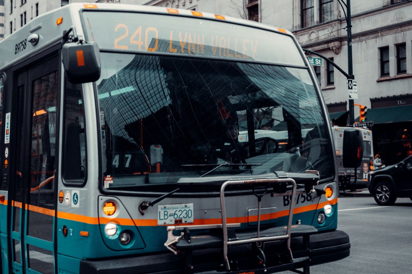 A city bus on the road, representative of Gwinnett's public transit system